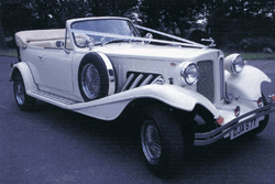white beauford wedding car